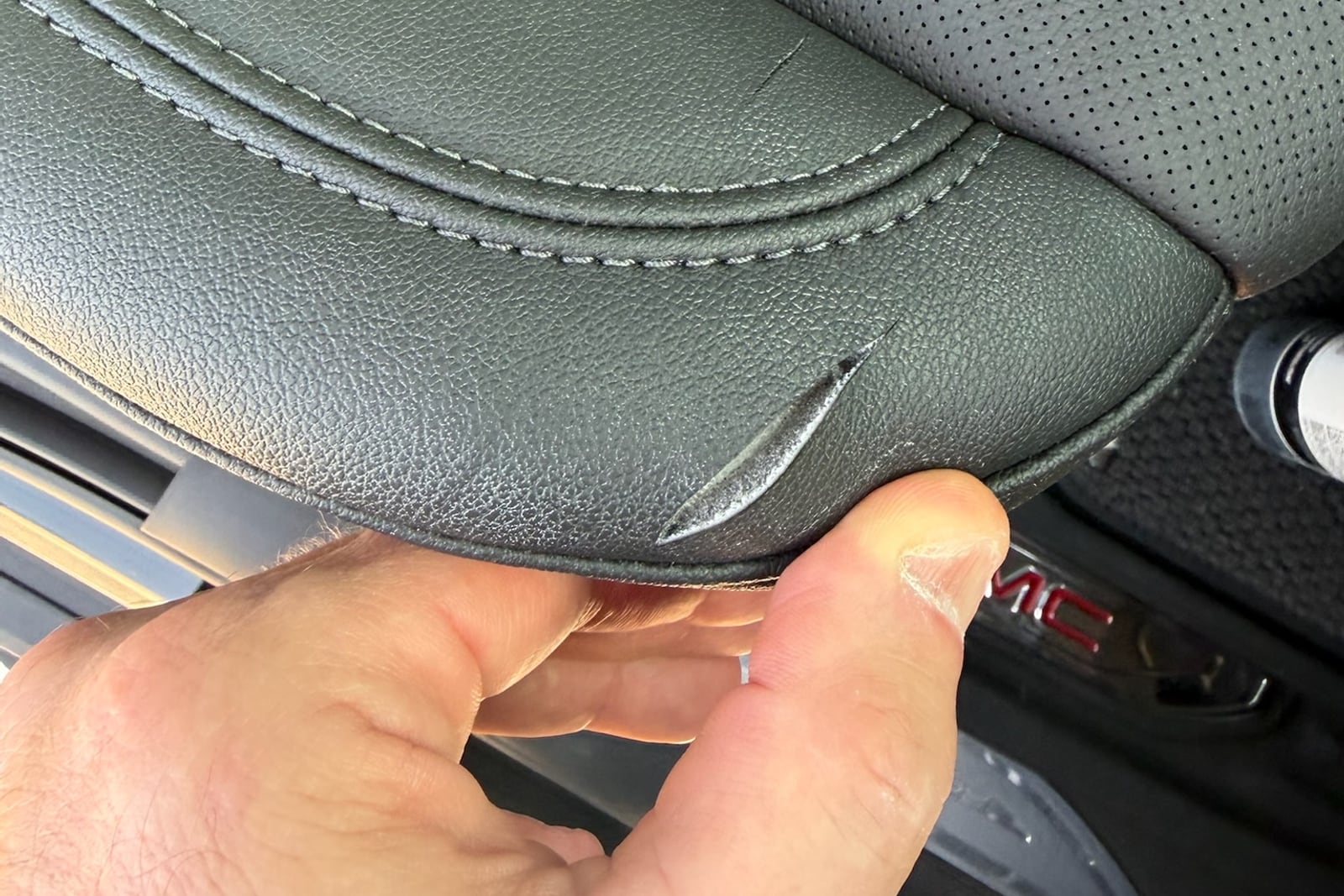 Before: Split seam on a leather seat — before and after repair by Dr. Vinyl DFW